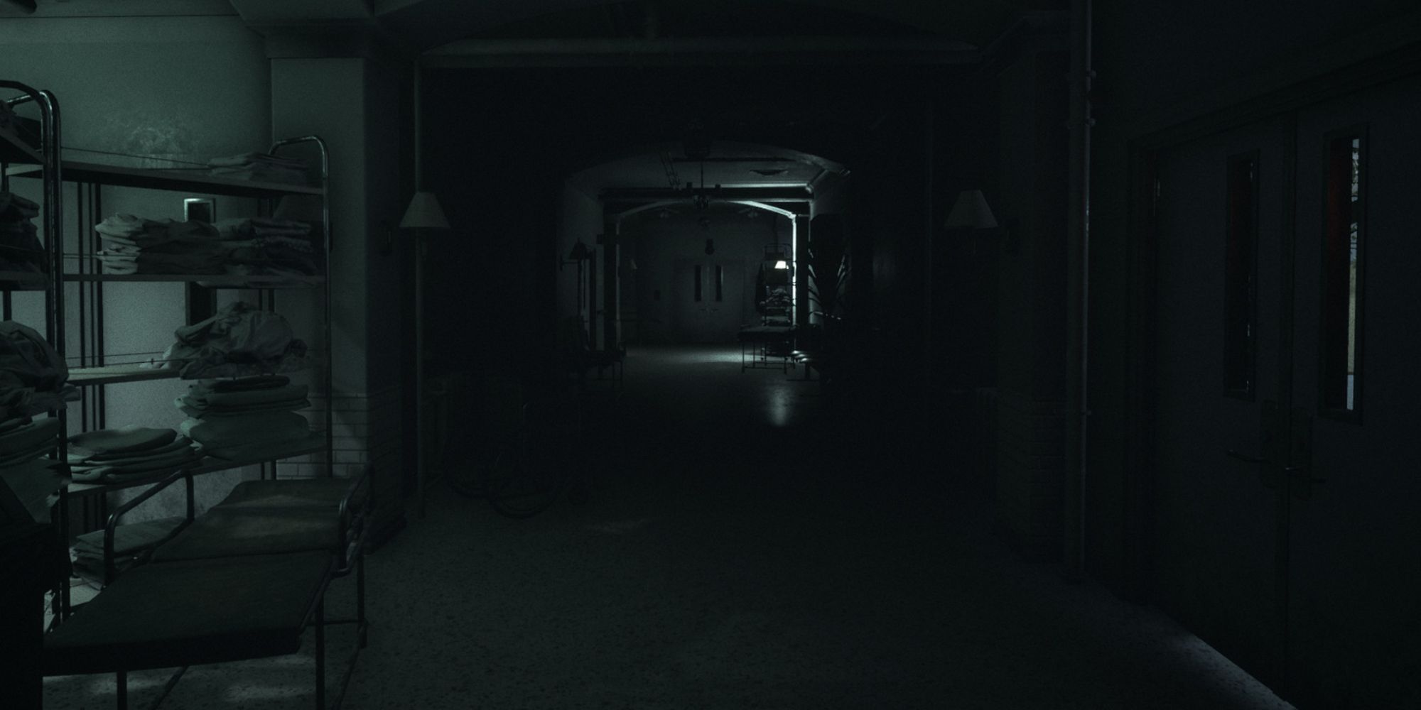 A laundry room in Visage showing a dark and oppressive corridor