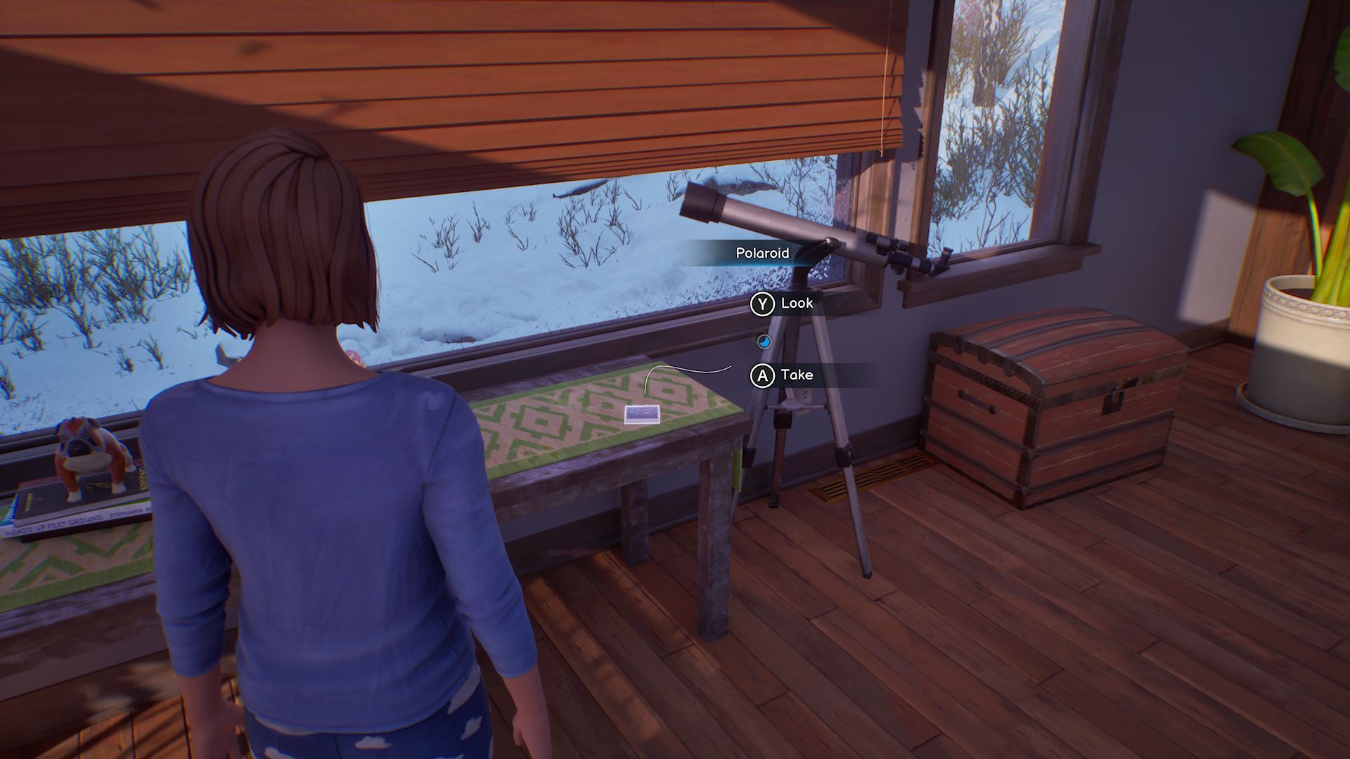 A screenshot with Max standing in front of the third Polaroid in Chapter 1, located on a table next to a telescope pointing out a window.