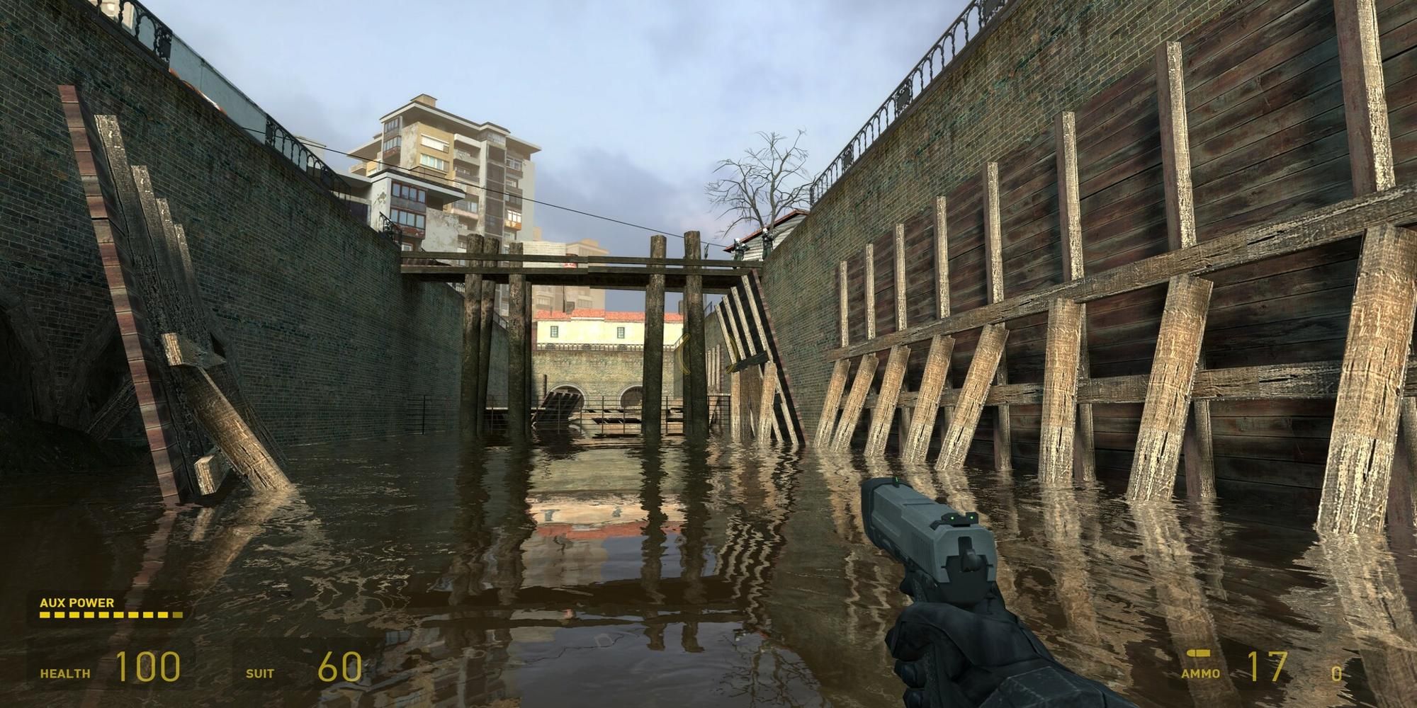 Player walking through water holding a pistol in Half Life 2