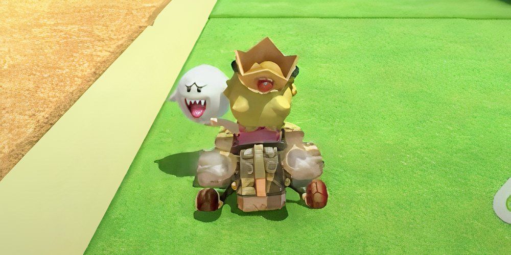 Boo Mario Kart World held by baby peach