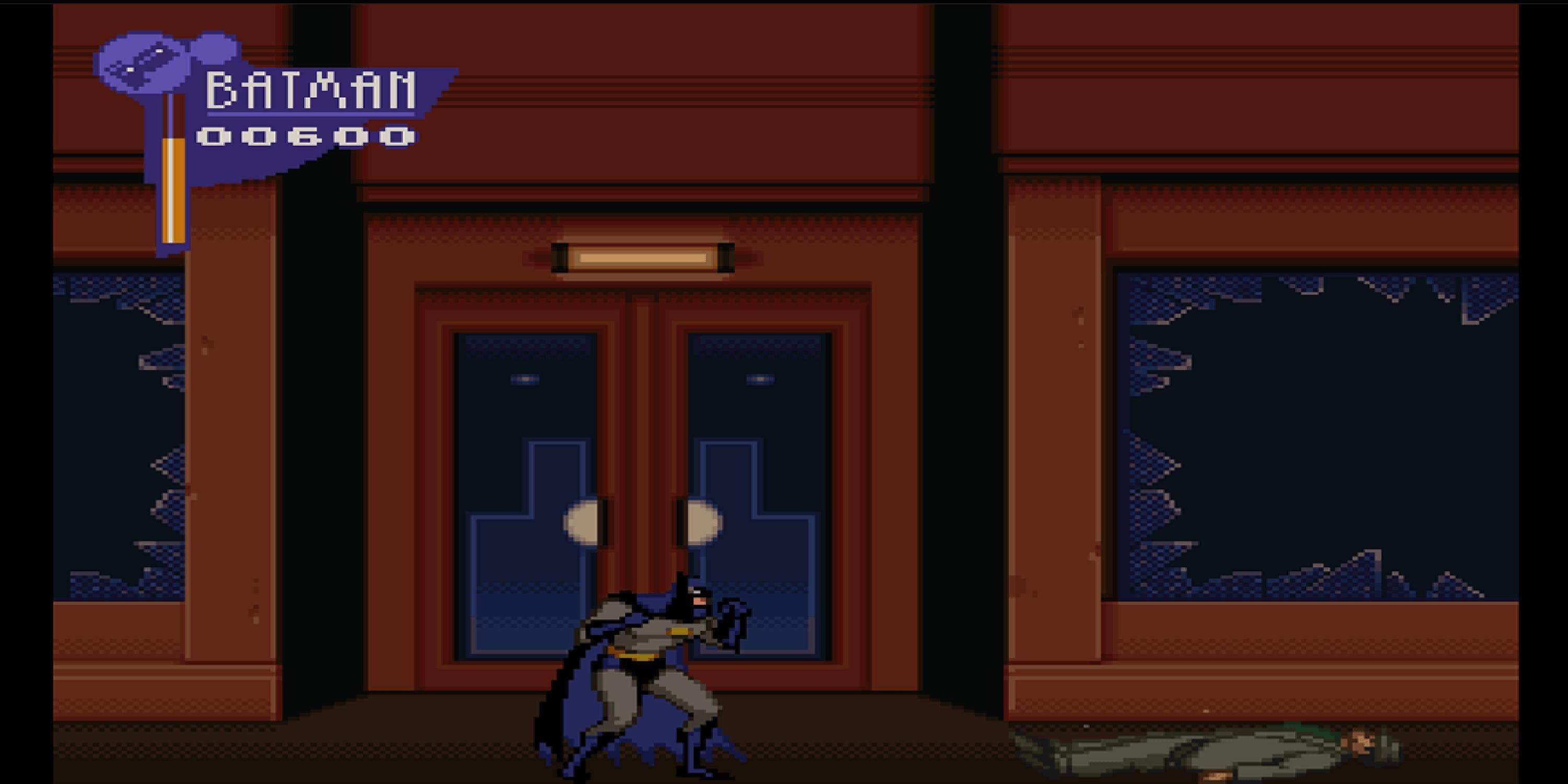 Batman after fighting an enemy in the street in The Adventures of Batman and Robin