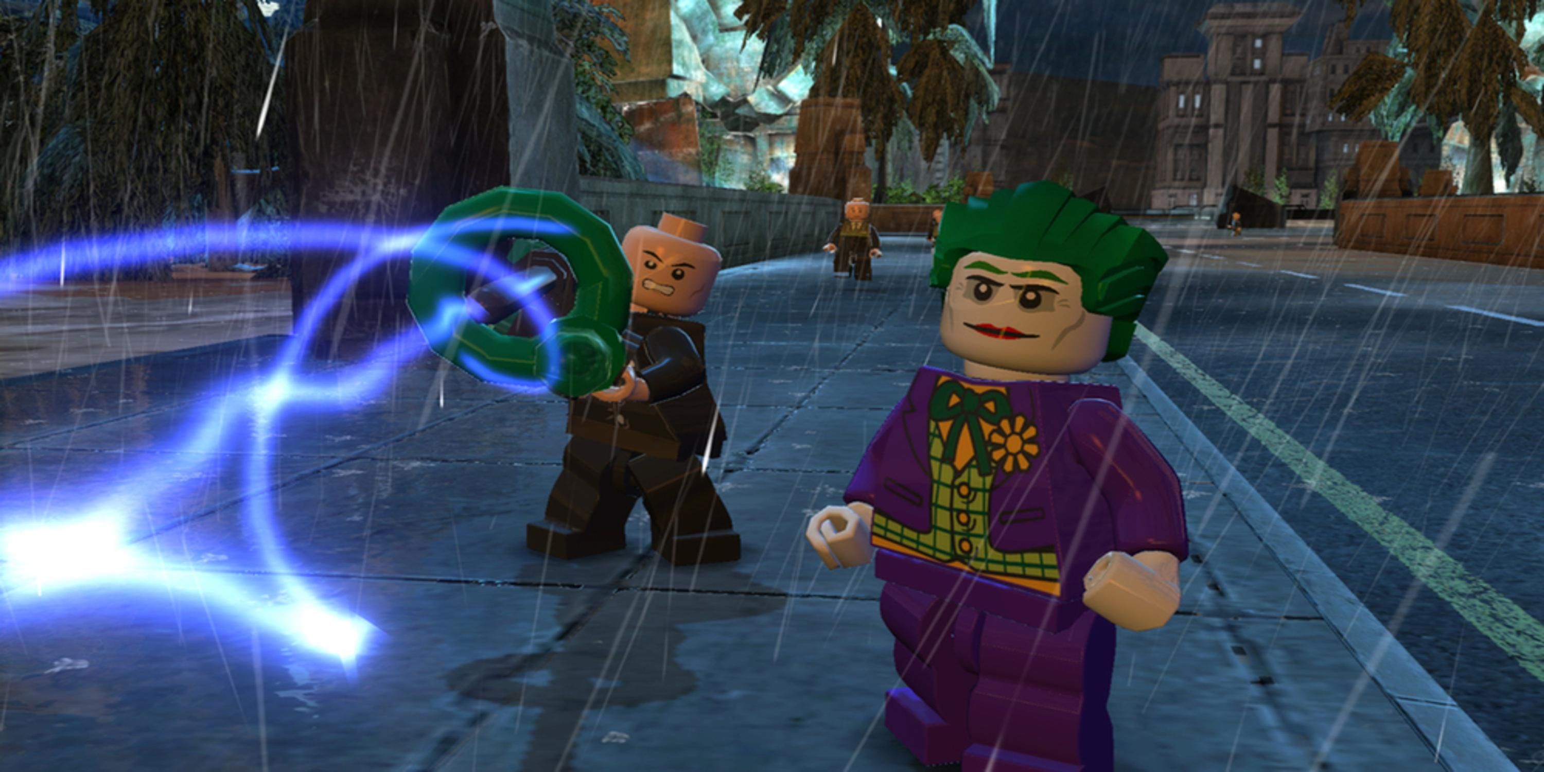 Joker and his goon standing in a street shooting a laser gun in Lego Batman 2 DC Super Heroes