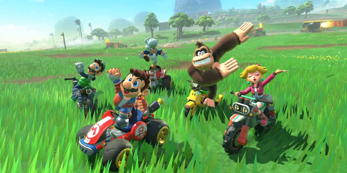 Mario-Kart-World-Mario-Luigi-Yoshi-Donkey-Kong-and-Princess-Peach-celebrating-in-grass