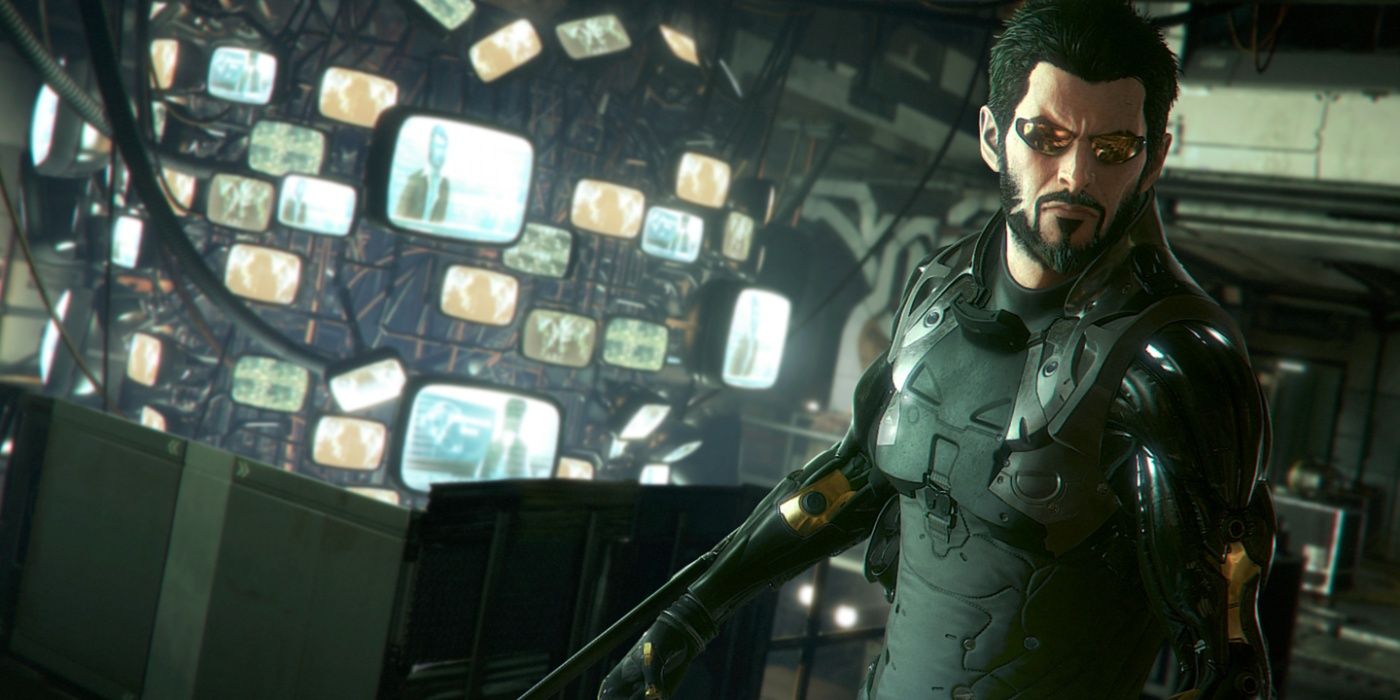 Deus-Ex-Mankind-Divided-Adam-Jensen-in-room-full-of-tv-screens-